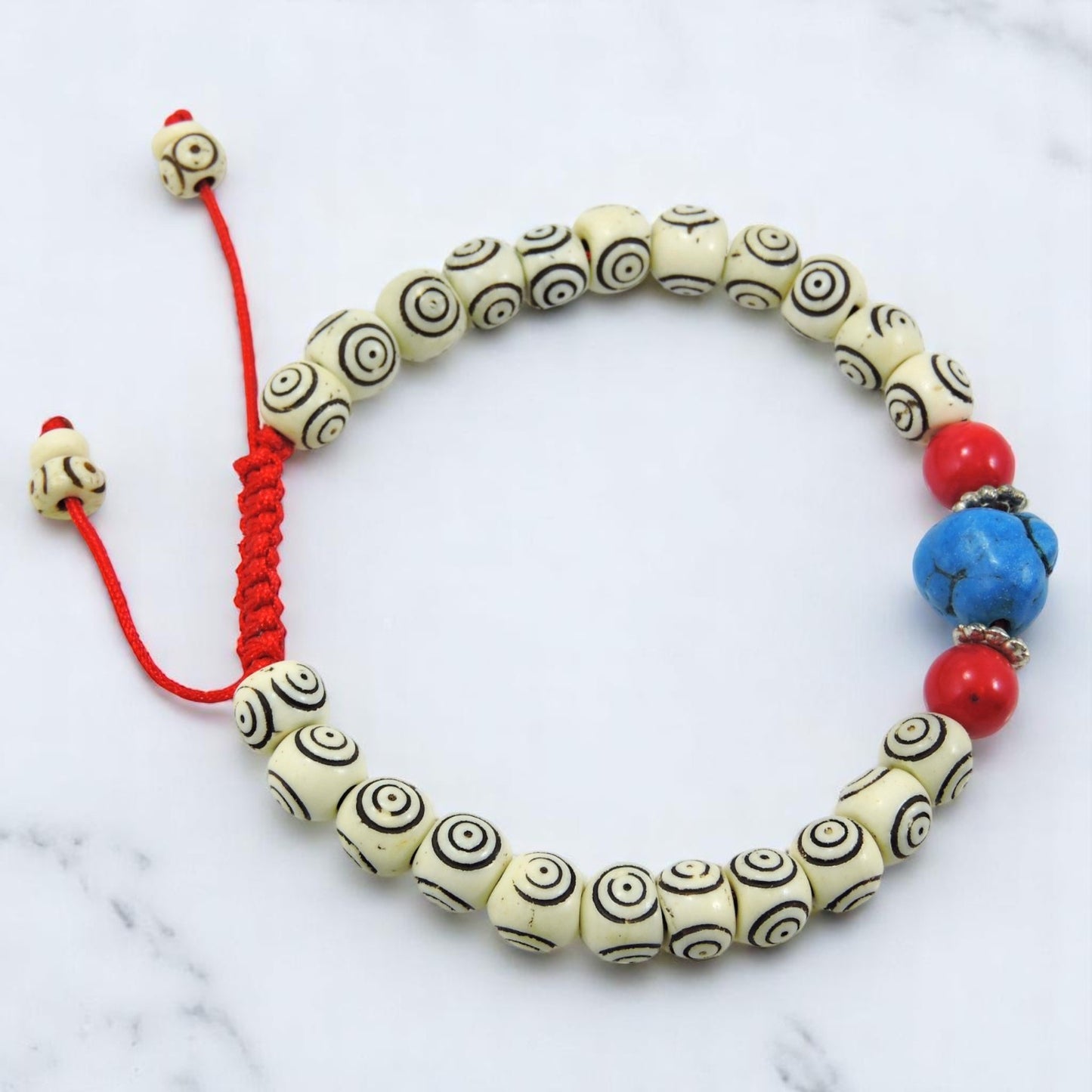 Carved Yak Bone Wrist Mala Bracelet with Turquoise and Coral Spacers