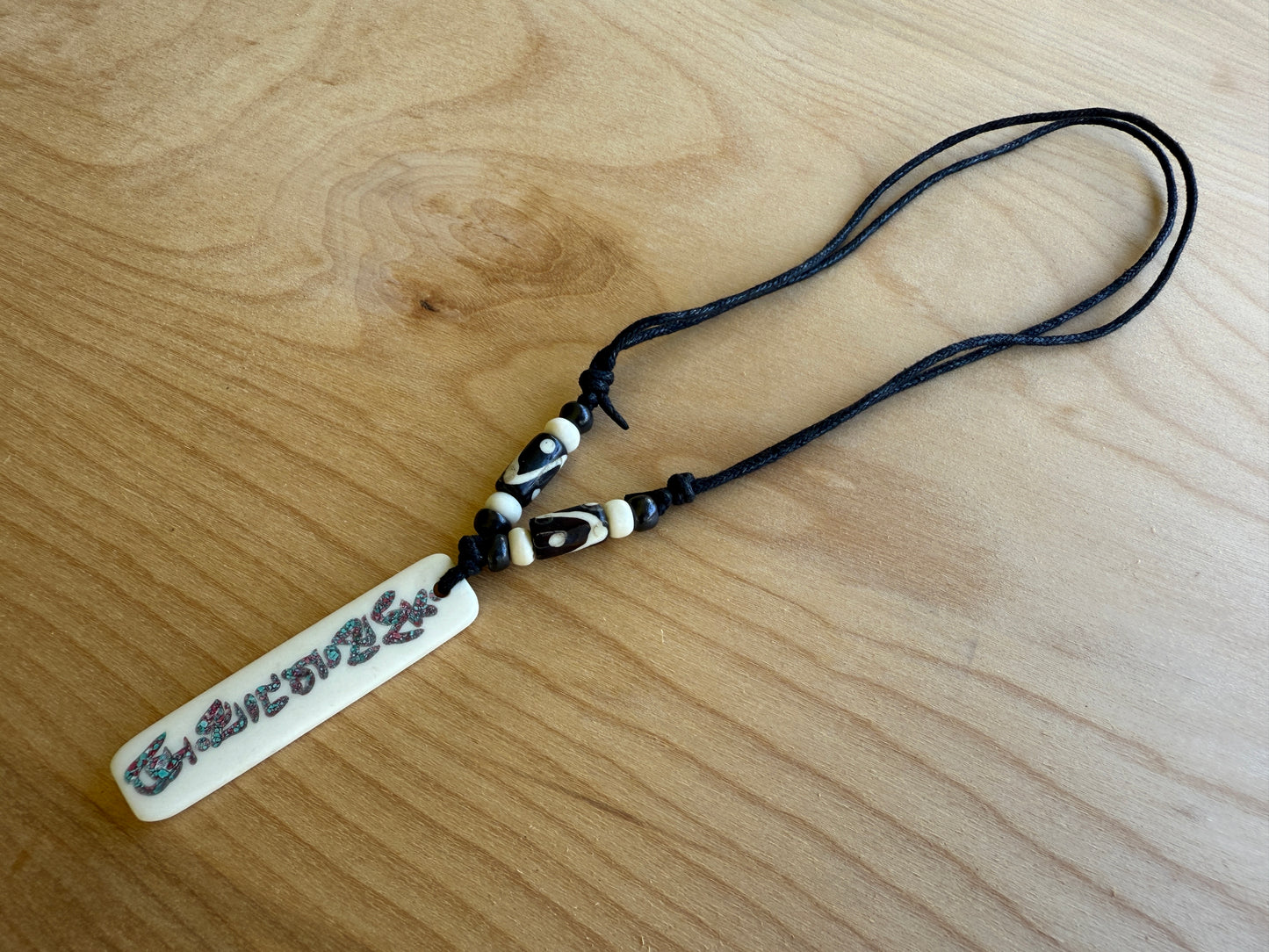 Buddha of Compassion Yak Bone Om Mani Pendant From Nepal