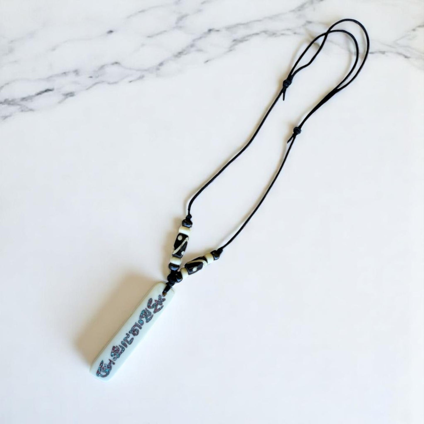 Buddha of Compassion Yak Bone Om Mani Pendant From Nepal